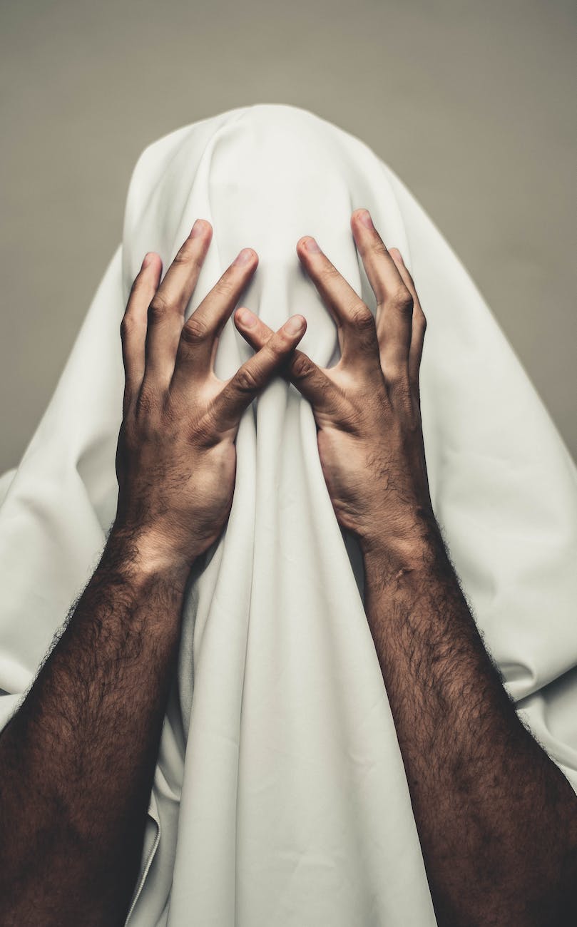 person covered with white textile